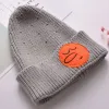 Wholesale of 2020 new cute long-nose knitted caps, baby knitted woolen caps with smiling face embroidery and pullover caps Application Scenario